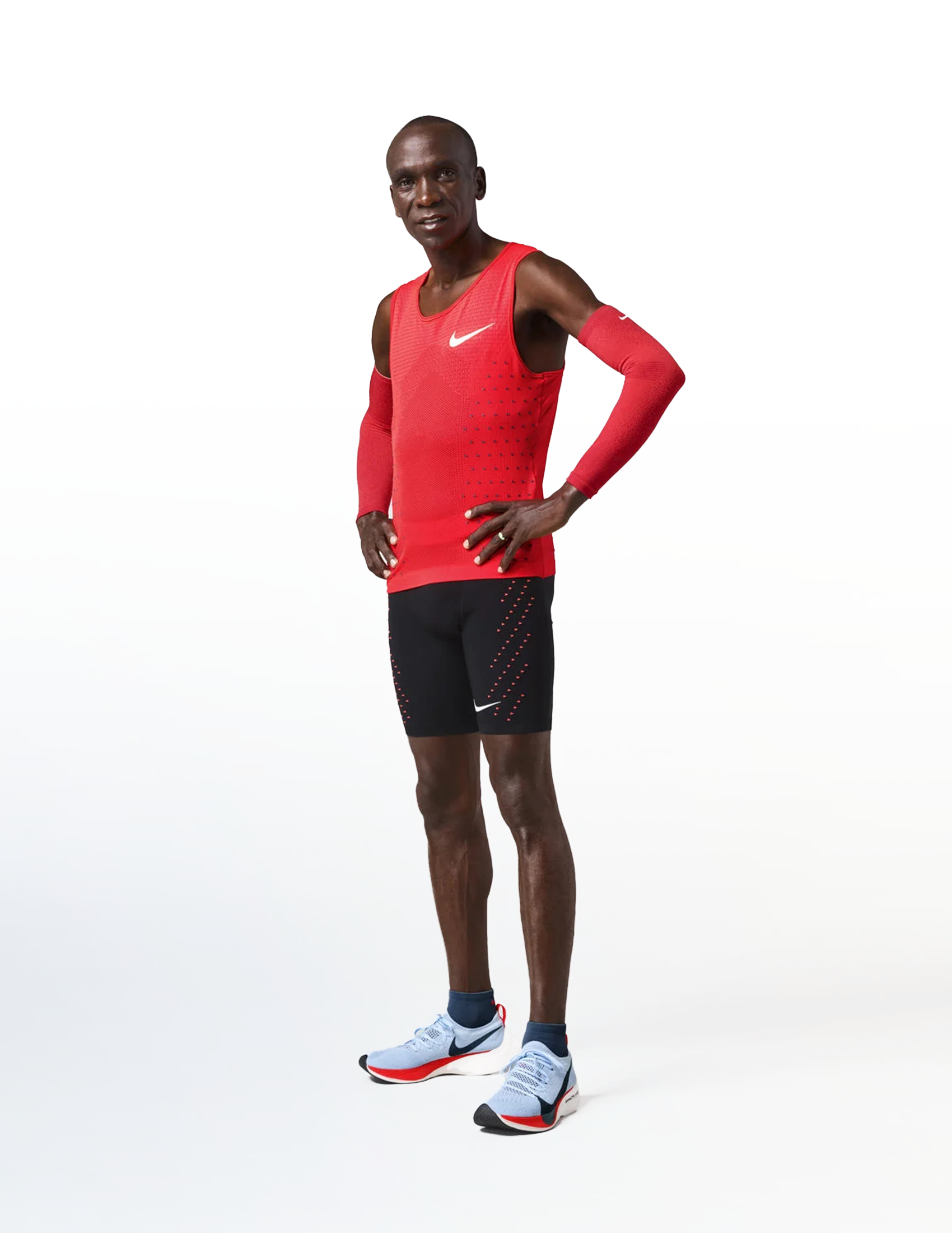 Eliud Kipchoge standing wearing Nike Vaporfly